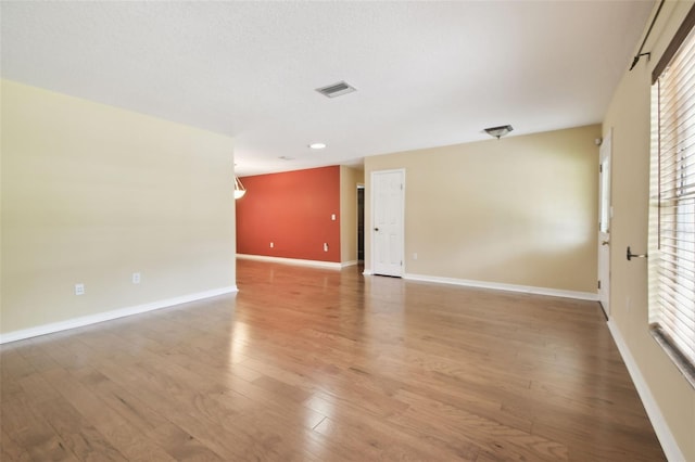 4514 John Moore Rd, Brandon, FL 33511 - unfurnished room featuring light wood finished floors and plenty of natural light