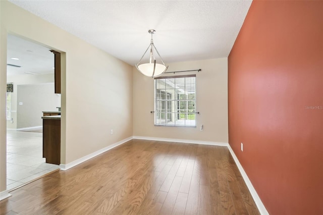 4514 John Moore Rd, Brandon, FL 33511 - unfurnished room featuring wood finished floors and baseboards