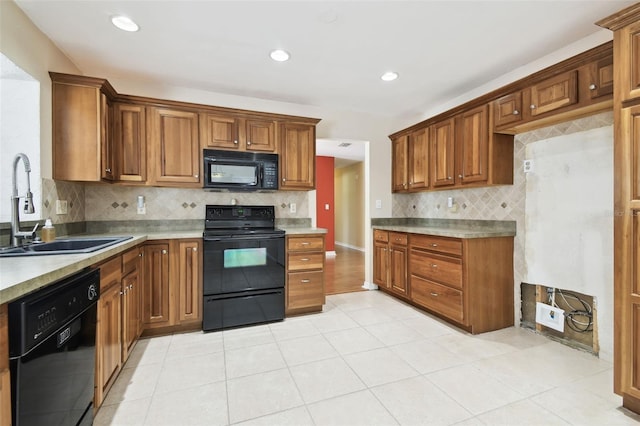4514 John Moore Rd, Brandon, FL 33511 - kitchen with black appliances, backsplash, brown cabinets, light tile patterned floors, and recessed lighting