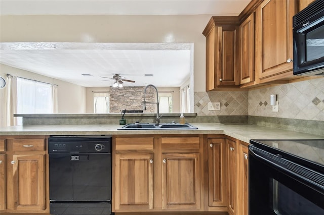4514 John Moore Rd, Brandon, FL 33511 - kitchen with black appliances, a ceiling fan, brown cabinetry, and light countertops