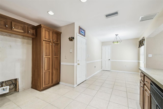 4514 John Moore Rd, Brandon, FL 33511 - kitchen with dishwasher, light tile patterned flooring, light countertops, and hanging light fixtures
