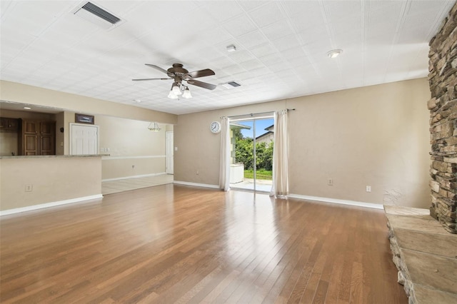 4514 John Moore Rd, Brandon, FL 33511 - unfurnished living room featuring ceiling fan and wood finished floors