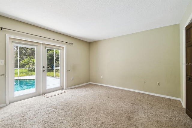 4514 John Moore Rd, Brandon, FL 33511 - unfurnished room featuring french doors, carpet, and a textured ceiling
