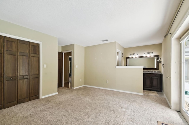 4514 John Moore Rd, Brandon, FL 33511 - unfurnished living room featuring light colored carpet and baseboards