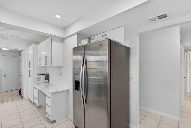 7051 Bright Creek Dr Unit 6, Sarasota, FL 34231 - kitchen with stainless steel refrigerator with ice dispenser, white cabinetry, light tile patterned floors, light countertops, and a ceiling fan