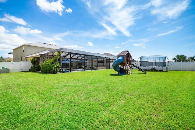 15206 Trinity Fall Way, Bradenton, FL 34212 - fenced backyard with a trampoline and a playground