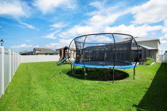 15206 Trinity Fall Way, Bradenton, FL 34212 - fenced backyard featuring a trampoline and a playground