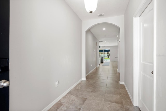 15206 Trinity Fall Way, Bradenton, FL 34212 - hallway featuring arched walkways and recessed lighting