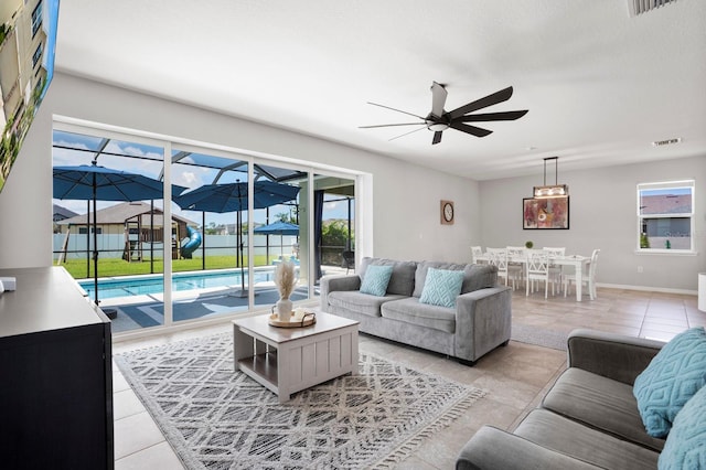 15206 Trinity Fall Way, Bradenton, FL 34212 - living room with a ceiling fan and light tile patterned floors