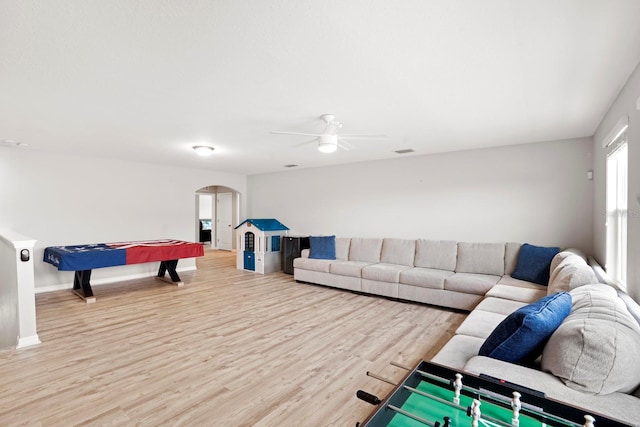 15206 Trinity Fall Way, Bradenton, FL 34212 - playroom with arched walkways, light wood finished floors, and ceiling fan