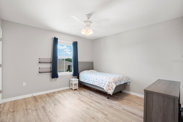 15206 Trinity Fall Way, Bradenton, FL 34212 - bedroom with light wood-style floors and ceiling fan