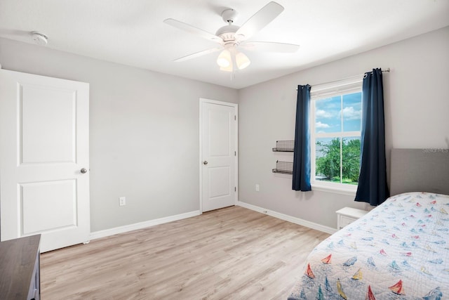 15206 Trinity Fall Way, Bradenton, FL 34212 - bedroom with light wood-style floors and a ceiling fan