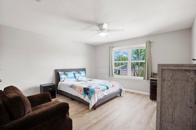 15206 Trinity Fall Way, Bradenton, FL 34212 - bedroom with light wood finished floors and a ceiling fan