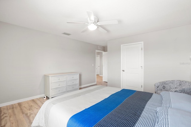 15206 Trinity Fall Way, Bradenton, FL 34212 - bedroom with light wood finished floors and ceiling fan
