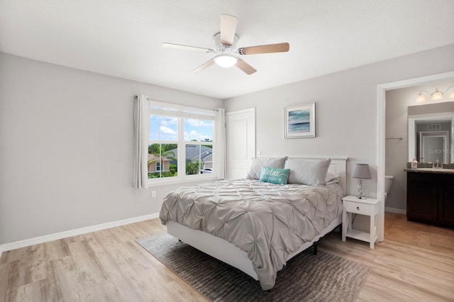 15206 Trinity Fall Way, Bradenton, FL 34212 - bedroom with light wood finished floors and ceiling fan