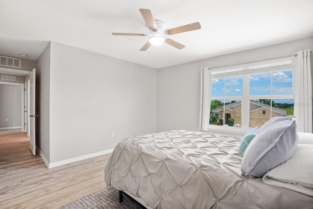 15206 Trinity Fall Way, Bradenton, FL 34212 - bedroom featuring light wood finished floors and ceiling fan