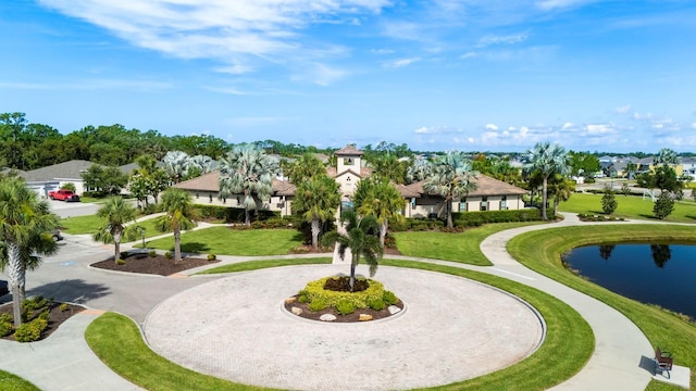 15206 Trinity Fall Way, Bradenton, FL 34212 - view of property's community with curved driveway, a residential view, a water view, and a yard