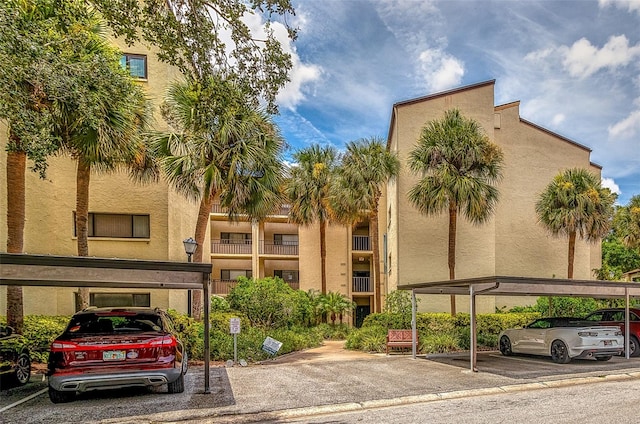 700 Starkey Rd Unit 1124, Largo, FL 33771 - view of building exterior featuring covered parking
