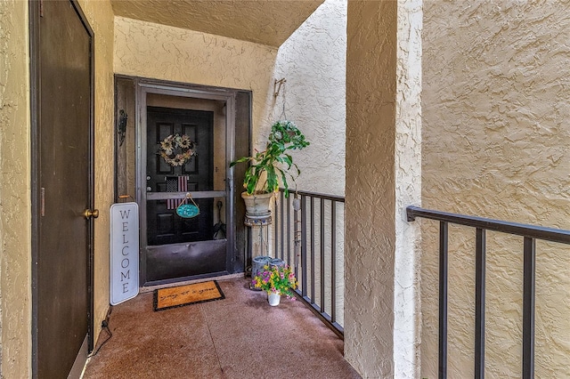 700 Starkey Rd Unit 1124, Largo, FL 33771 - doorway to property with a balcony and stucco siding