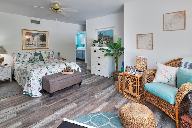 700 Starkey Rd Unit 1124, Largo, FL 33771 - bedroom with wood finished floors and ensuite bathroom
