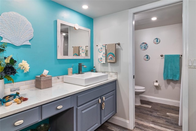 700 Starkey Rd Unit 1124, Largo, FL 33771 - bathroom featuring vanity, wood finished floors, and recessed lighting