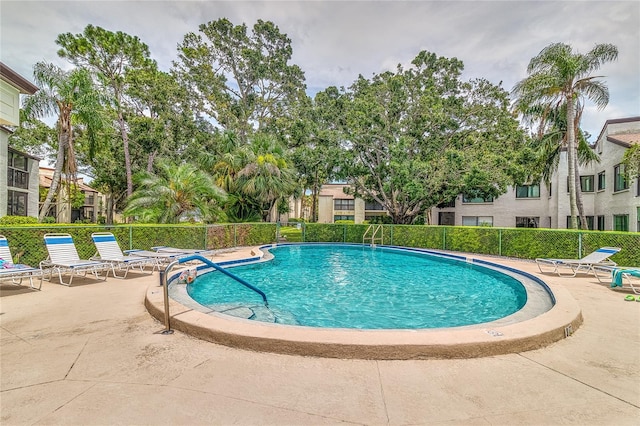 700 Starkey Rd Unit 1124, Largo, FL 33771 - community pool featuring a patio