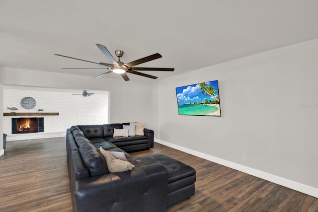 6000 115th Ln, Seminole, FL 33772 - living area featuring dark wood-style flooring, ceiling fan, and a fireplace