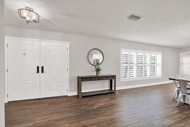 6000 115th Ln, Seminole, FL 33772 - foyer with a chandelier and wood finished floors