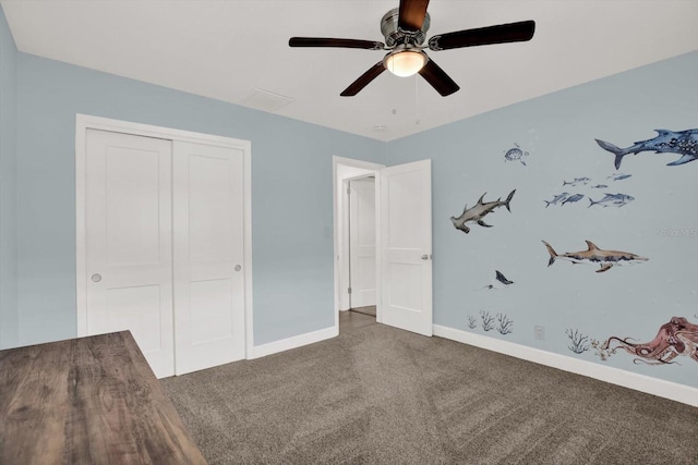 6000 115th Ln, Seminole, FL 33772 - unfurnished bedroom with carpet floors, a closet, and a ceiling fan