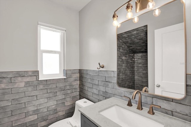 6000 115th Ln, Seminole, FL 33772 - bathroom featuring vanity, tile walls, and wainscoting