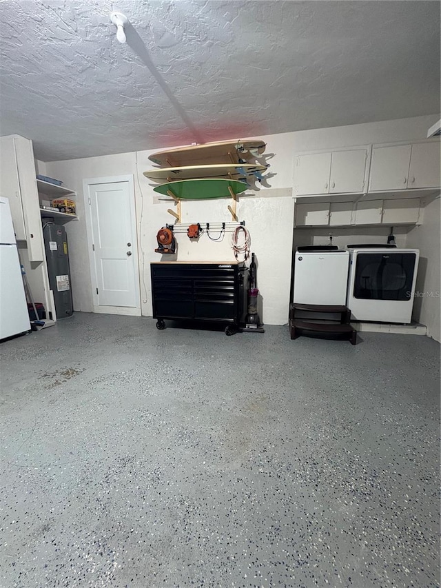 6000 115th Ln, Seminole, FL 33772 - garage featuring washer / clothes dryer, water heater, and freestanding refrigerator
