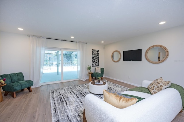4504 Grainary Ave, Tampa, FL 33624 - living area with recessed lighting and light wood-style flooring