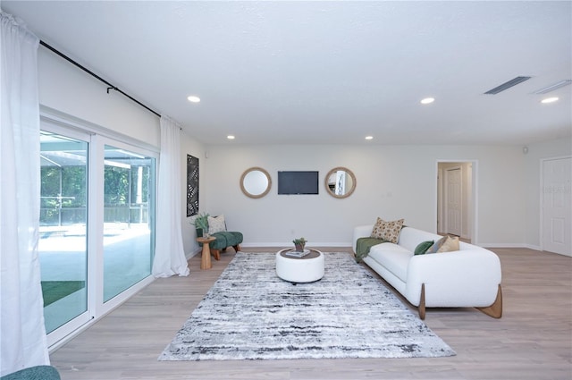 4504 Grainary Ave, Tampa, FL 33624 - living area with recessed lighting and light wood-style flooring