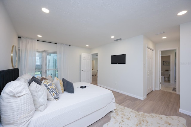 4504 Grainary Ave, Tampa, FL 33624 - bedroom with light wood-type flooring and recessed lighting