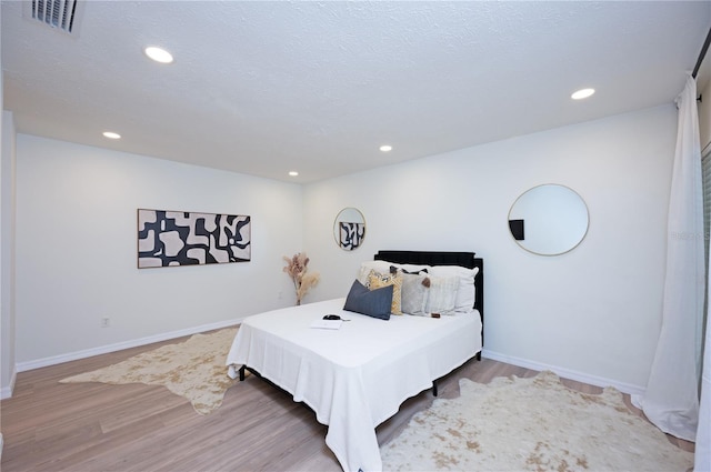 4504 Grainary Ave, Tampa, FL 33624 - bedroom featuring wood finished floors and recessed lighting