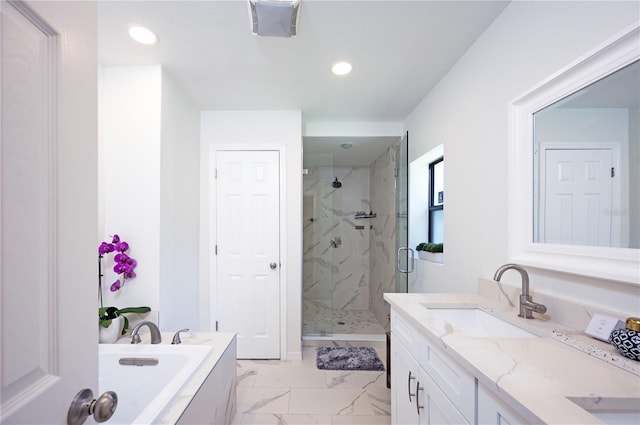 4504 Grainary Ave, Tampa, FL 33624 - full bath with a marble finish shower, double vanity, a bath, marble finish flooring, and recessed lighting