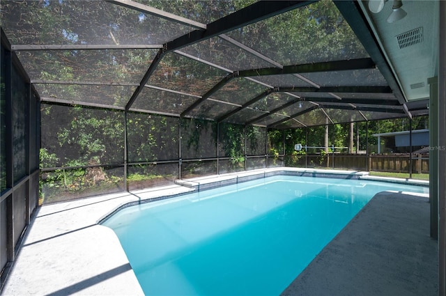 4504 Grainary Ave, Tampa, FL 33624 - outdoor pool featuring glass enclosure