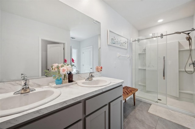 16051 Soft Fern Trce, Odessa, FL 33556 - full bathroom featuring a stall shower, double vanity, and tile patterned flooring
