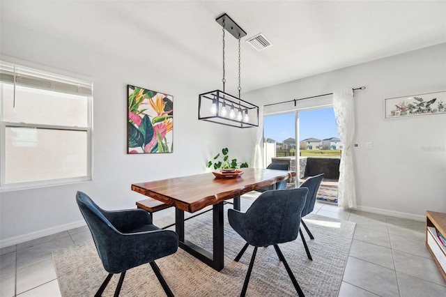 16051 Soft Fern Trce, Odessa, FL 33556 - dining area featuring light tile patterned floors and baseboards