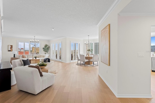 371 Channelside Walk Way Unit 1104, Tampa, FL 33602 - living room with a chandelier, light wood-style floors, crown molding, and a textured ceiling