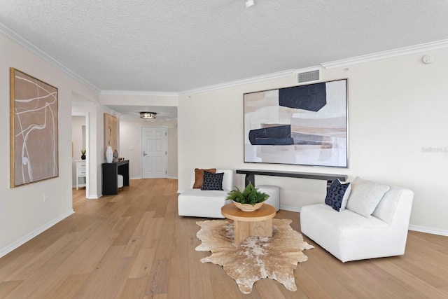 371 Channelside Walk Way Unit 1104, Tampa, FL 33602 - living area featuring light wood-style floors, ornamental molding, and a textured ceiling