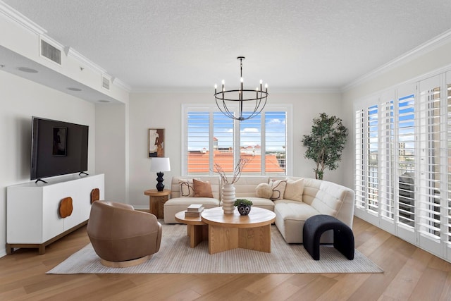 371 Channelside Walk Way Unit 1104, Tampa, FL 33602 - living area with light wood finished floors, a chandelier, ornamental molding, and a textured ceiling