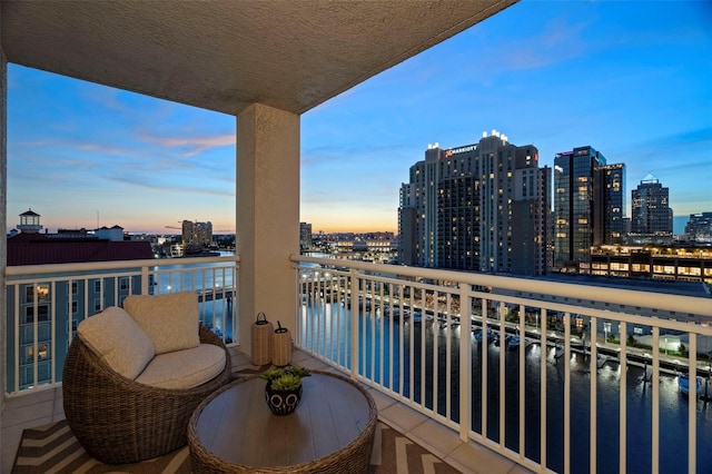 371 Channelside Walk Way Unit 1104, Tampa, FL 33602 - balcony at dusk featuring a skyline view and a water view