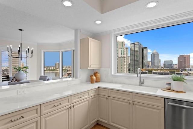 371 Channelside Walk Way Unit 1104, Tampa, FL 33602 - kitchen with dishwasher, a chandelier, ornamental molding, a skyline view, and hanging light fixtures