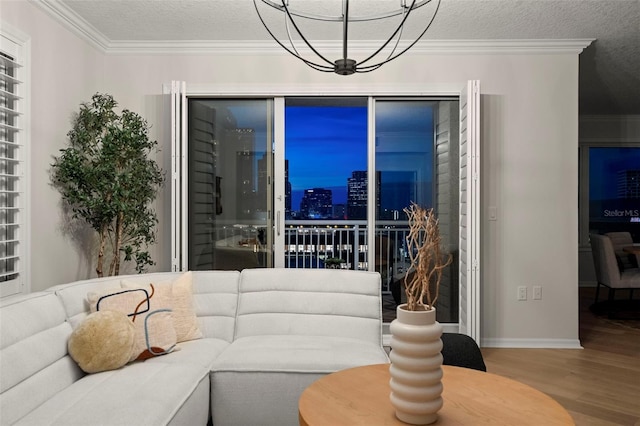 371 Channelside Walk Way Unit 1104, Tampa, FL 33602 - living area with wood finished floors, ornamental molding, a textured ceiling, a chandelier, and a view of city