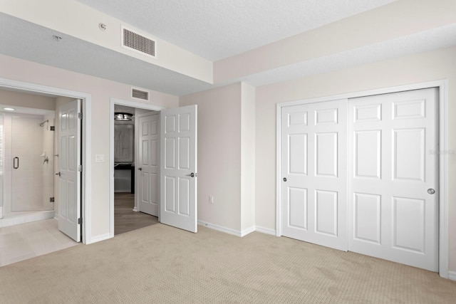 371 Channelside Walk Way Unit 1104, Tampa, FL 33602 - unfurnished bedroom featuring carpet, a closet, and connected bathroom