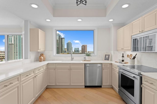 371 Channelside Walk Way Unit 1104, Tampa, FL 33602 - kitchen with stainless steel appliances, recessed lighting, light wood-style flooring, ornamental molding, and tasteful backsplash