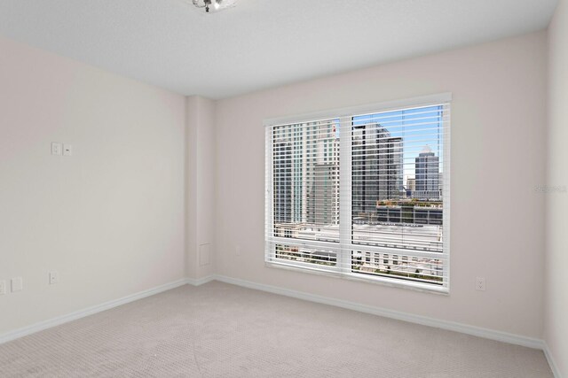 371 Channelside Walk Way Unit 1104, Tampa, FL 33602 - spare room featuring carpet flooring and a view of city