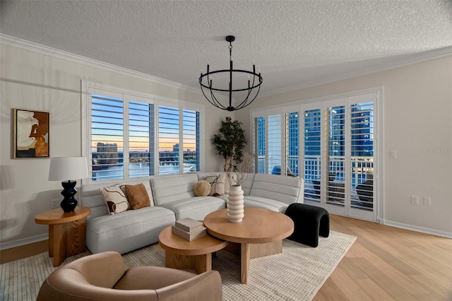 371 Channelside Walk Way Unit 1104, Tampa, FL 33602 - living area with ornamental molding, a chandelier, a textured ceiling, and wood finished floors