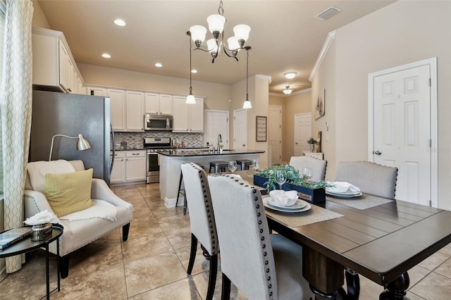 6934 Old Benton Dr, Apollo Beach, FL 33572 - dining space featuring a chandelier, recessed lighting, light tile patterned flooring, and ornamental molding
